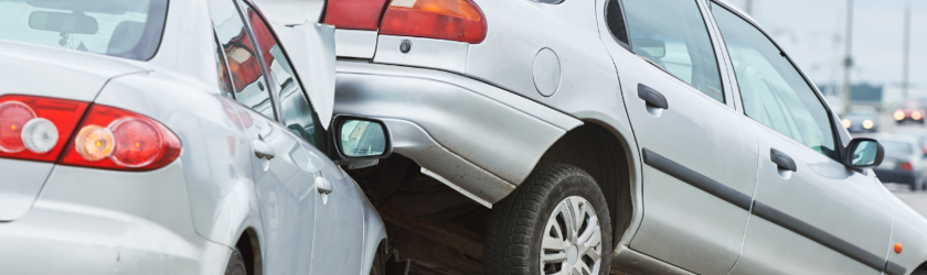 damaged cars on a street after a car accident