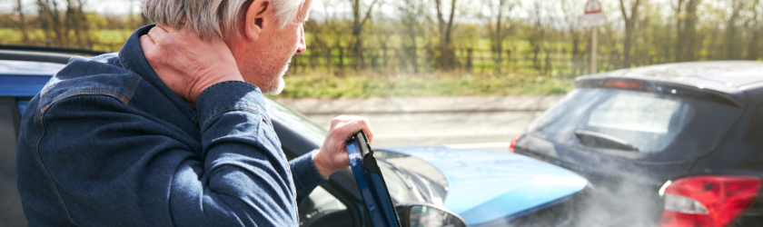 an Uber passenger with whiplash getting out of the car after a car traffic accident