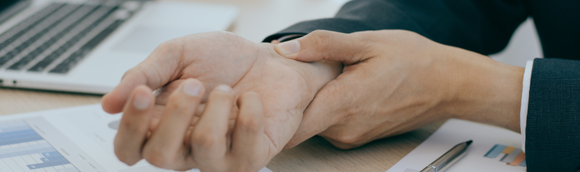 an employee suffering from a wrist pain due to an overexertion at work