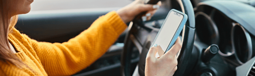 person texting while driving